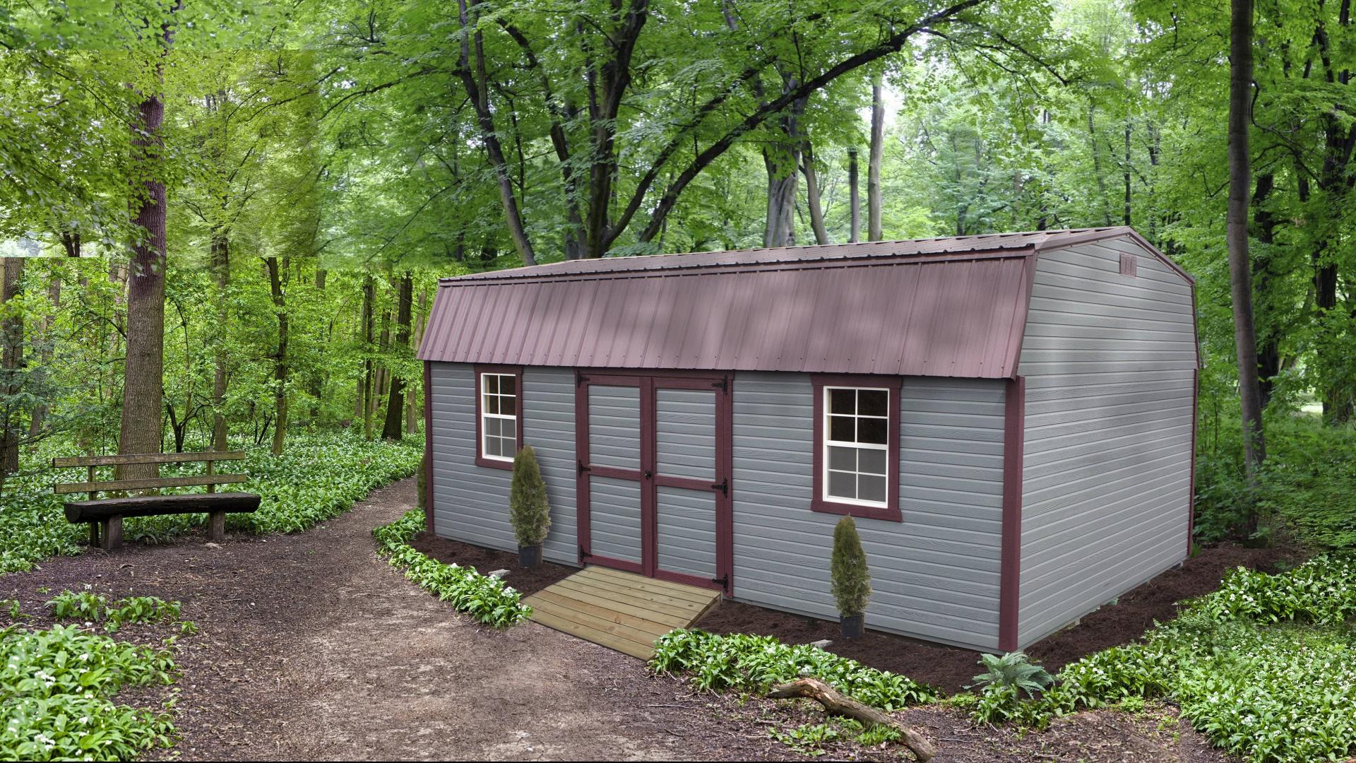 Grey high barn with burgundy trim