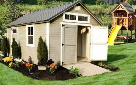Tan garden shed with white trim