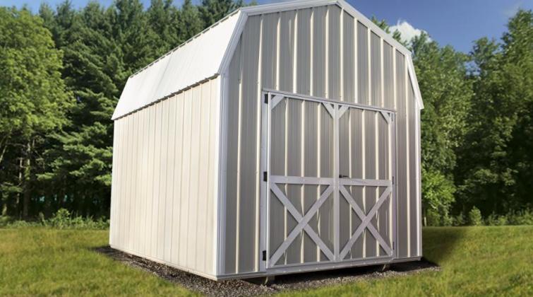 compass high barn with white metal siding